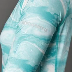 2022 Weatherbeeta Womens Ruby Printed Long Sleeve Top 1009342023 - Turquoise Swirl 9 2022 Weatherbeeta Womens Ruby Printed Long Sleeve Top 1009342023 - Turquoise Swirl -Equestrian Clothing Store 4511 1009342000 TURQUOISESWIRLMARBLEPRINT WB Ruby LS CU2 Image Null Hero.700x700
